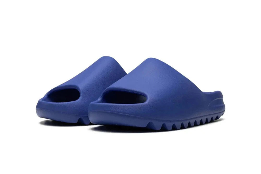 Adidas Yeezy Slide Azure in vibrant blue, sleek slip-on design with cushioned footbed for all-day comfort and casual wear.