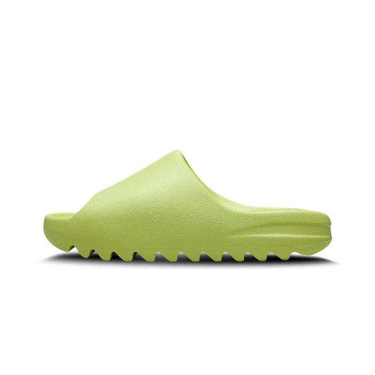 Adidas Yeezy Slide 'Glow Green' in neon green, single-piece EVA foam construction with cushioned footbed and deep ridged outsole for comfort and stability