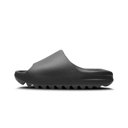 Adidas Yeezy Slide 'Onyx' in all-black, one-piece slip-on design with cushioned footbed, open-toe, and notched outsole for grip and comfort