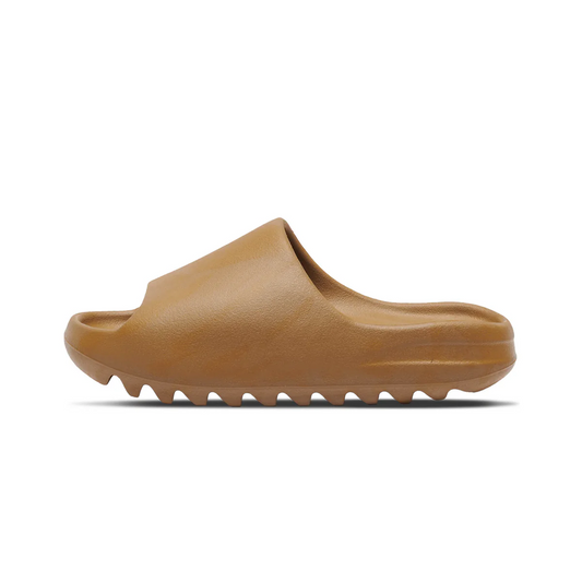 Adidas Yeezy Slide 'Ochre' in diffuse brown, monochromatic EVA foam construction with soft footbed, deep horizontal grooves on the outsole for durability and traction.