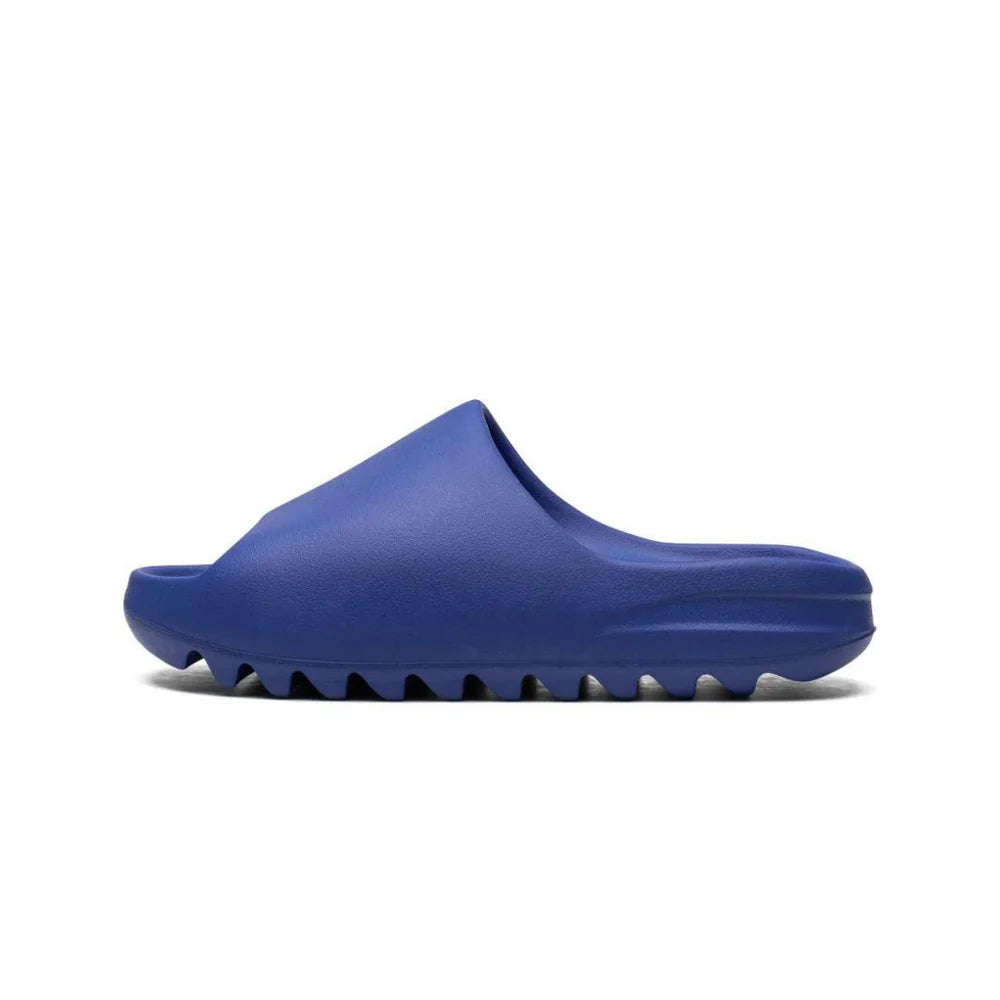 Adidas Yeezy Slide Azure in vibrant blue, sleek slip-on design with cushioned footbed for all-day comfort and casual wear.